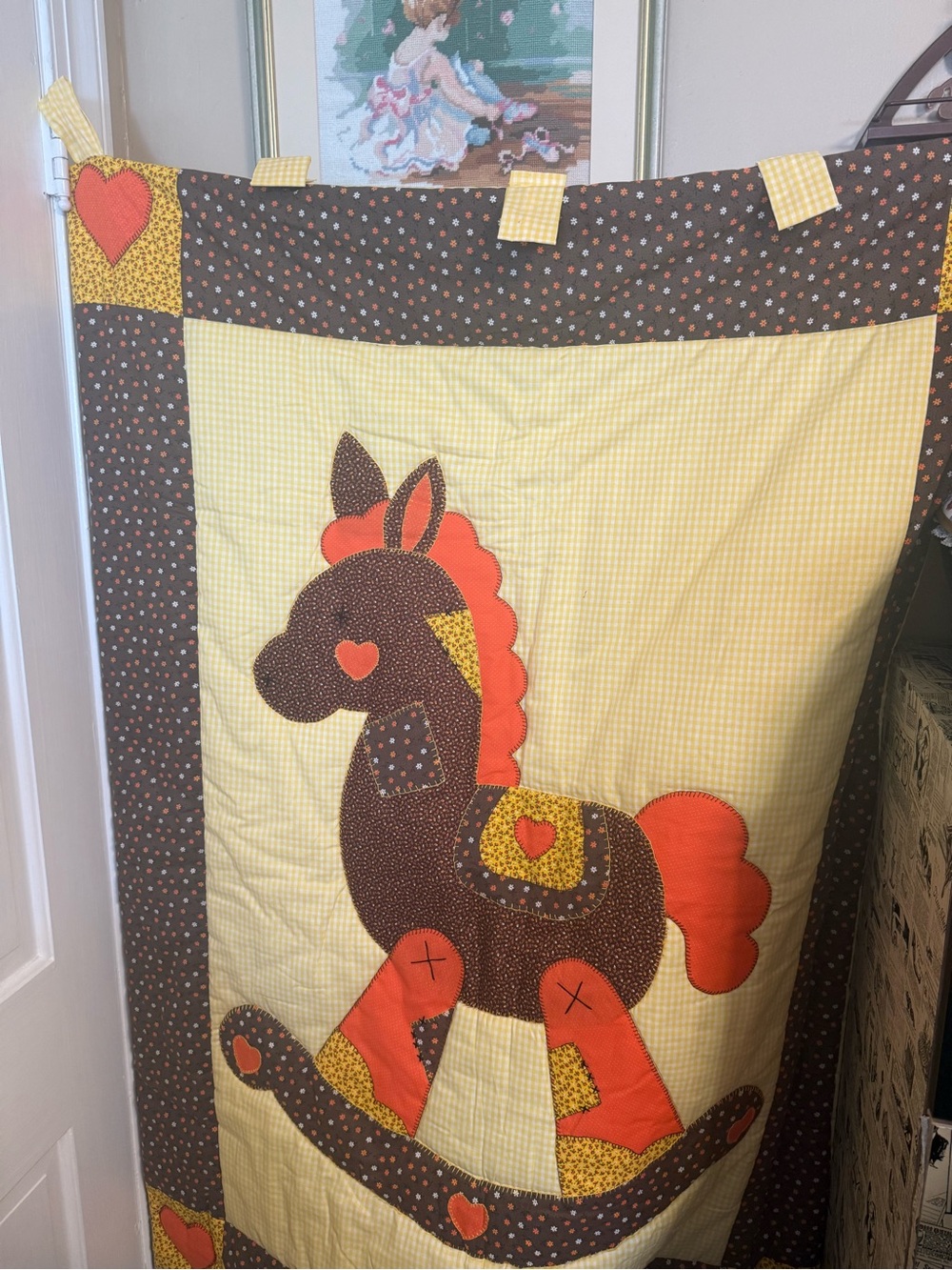 handmade baby quilt/wall hanging featuring a rocking horse applique design.